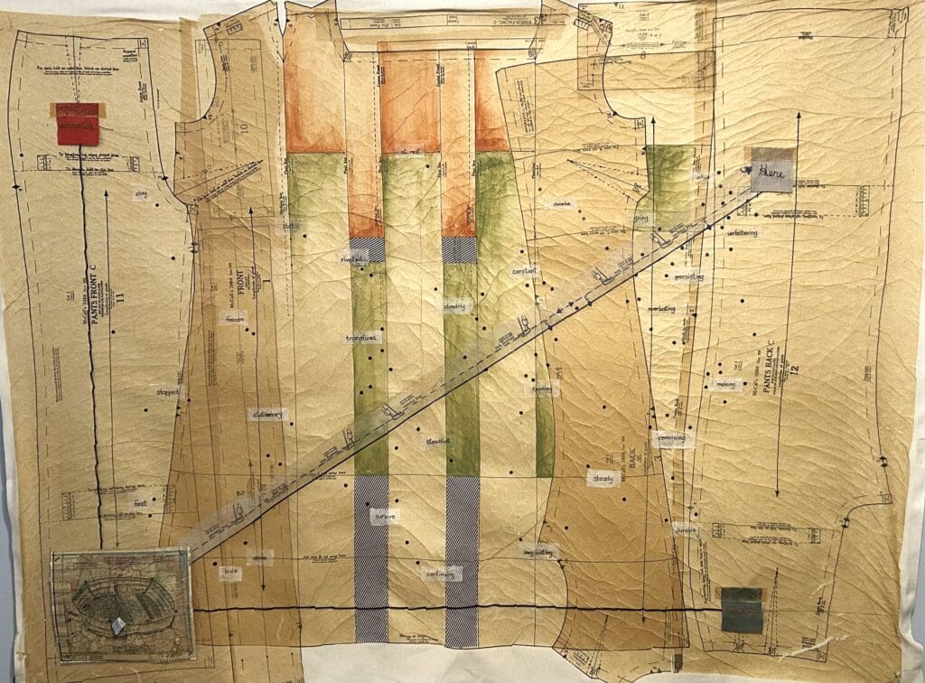 Artwork by Karen McGarry depicting antique sewing pattern paper, marked with faint vertical watercolor stripes and a heavy diagonal line.