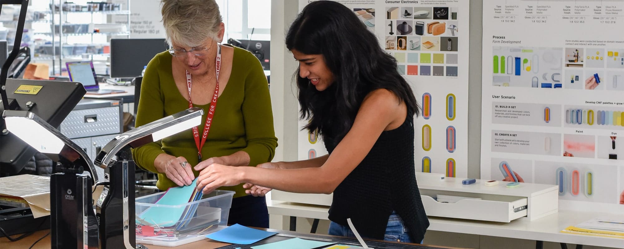 student working with faculty in the color & materials design studio