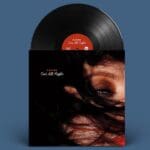 A vinyl record and cover for Katiee's "Out All Night" album featuring a close-up portrait.