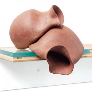 Crafts Fiber Design. Two floppy looking brown vases laif on top of each other.