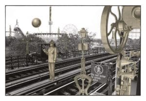 a figure standing on train tracks