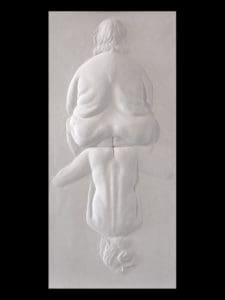 a relief sculpture of one figure sitting on top of another