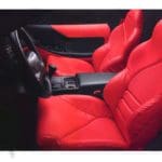 red seats nd black leather interior of a corvette