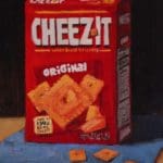 a box of cheezits on a blue cloth