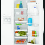 a fully stocked white fridge with one door ajar