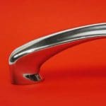 chrome door handle on red car