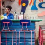 blue and pink chairs at a bar