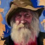 a man with a full white beard with a floppy brown hat