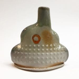 a red circle on a shino glazed bottle