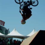 a person doing a backflip on a bmx bike